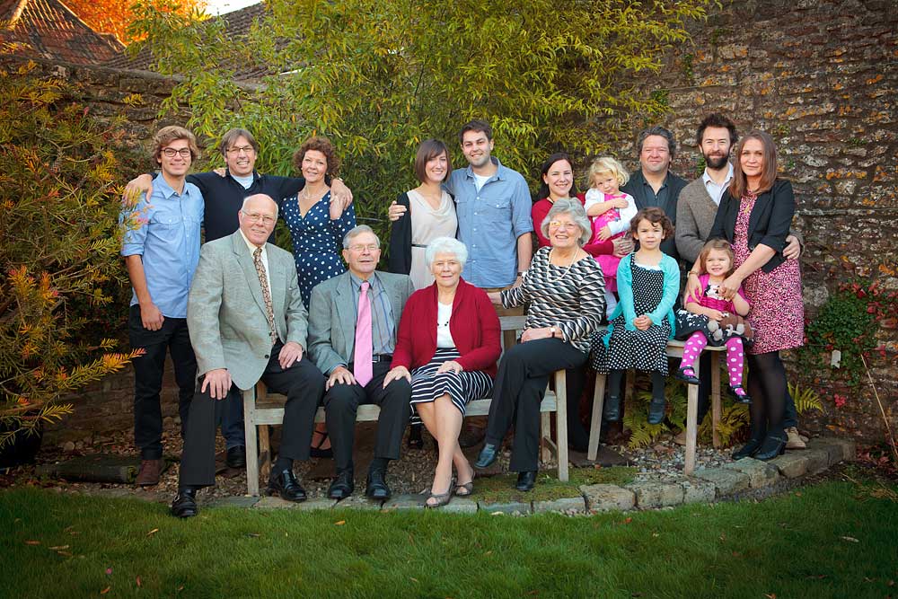large family group smile to camera at a 80th birthday party