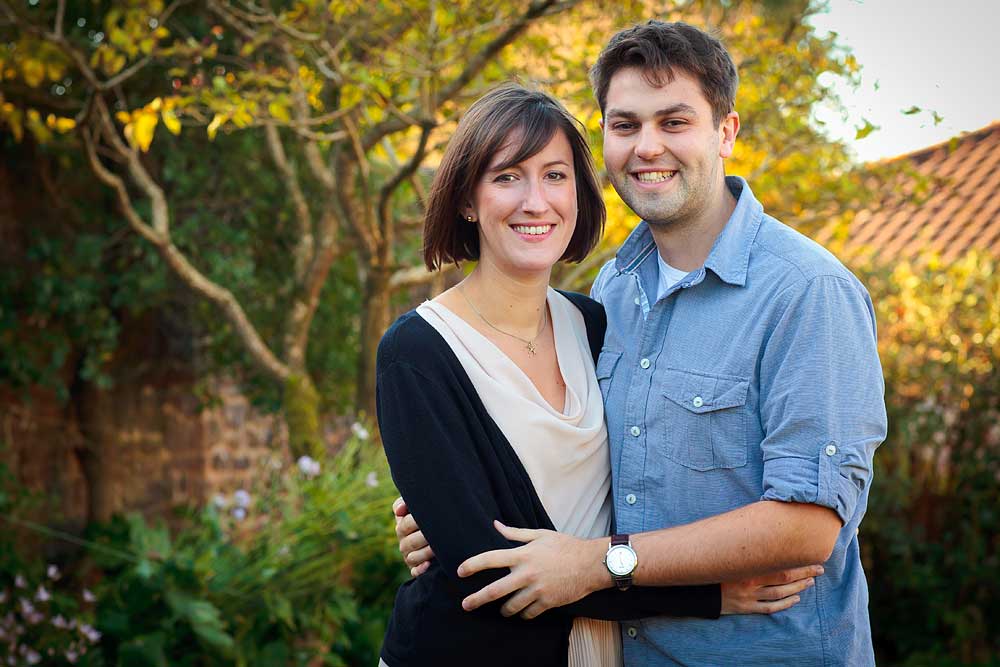 couple in an embrace for a family photo