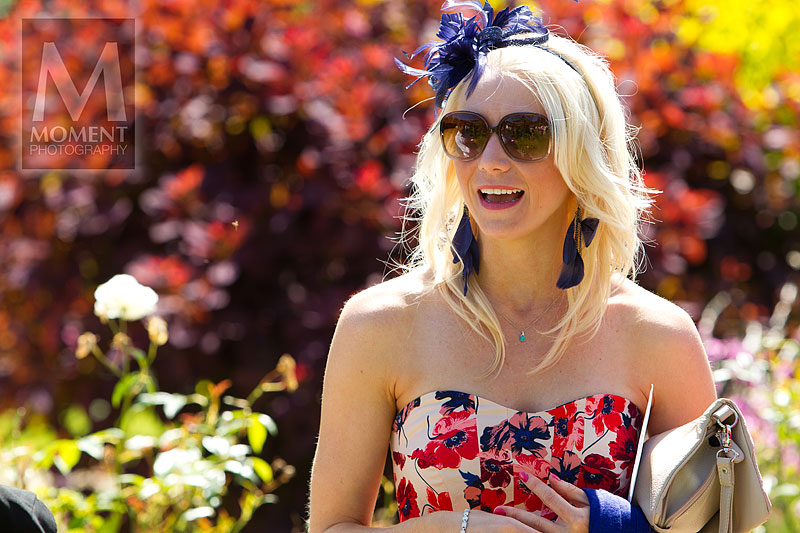 A colourful photo of a wedding guest in the Gardens of Gants Mill in Bruton Somerset