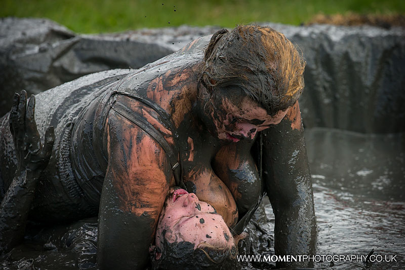 One lady has the upper hand as she pins down the other in an exciting mud wrestling match at The Lowland Games 2016
