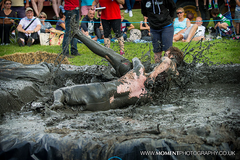 An explosion of mud on impact during the mud wrestling at The Lowland Games 2016