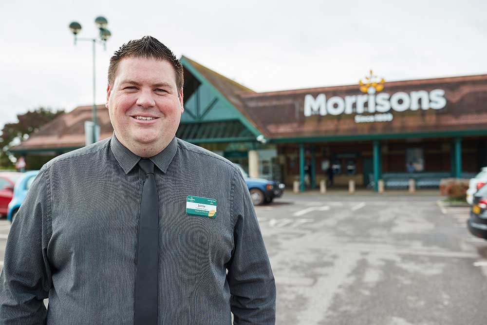 Corporate portrait of Morrisons supermarket manager outside the Bridgwater store