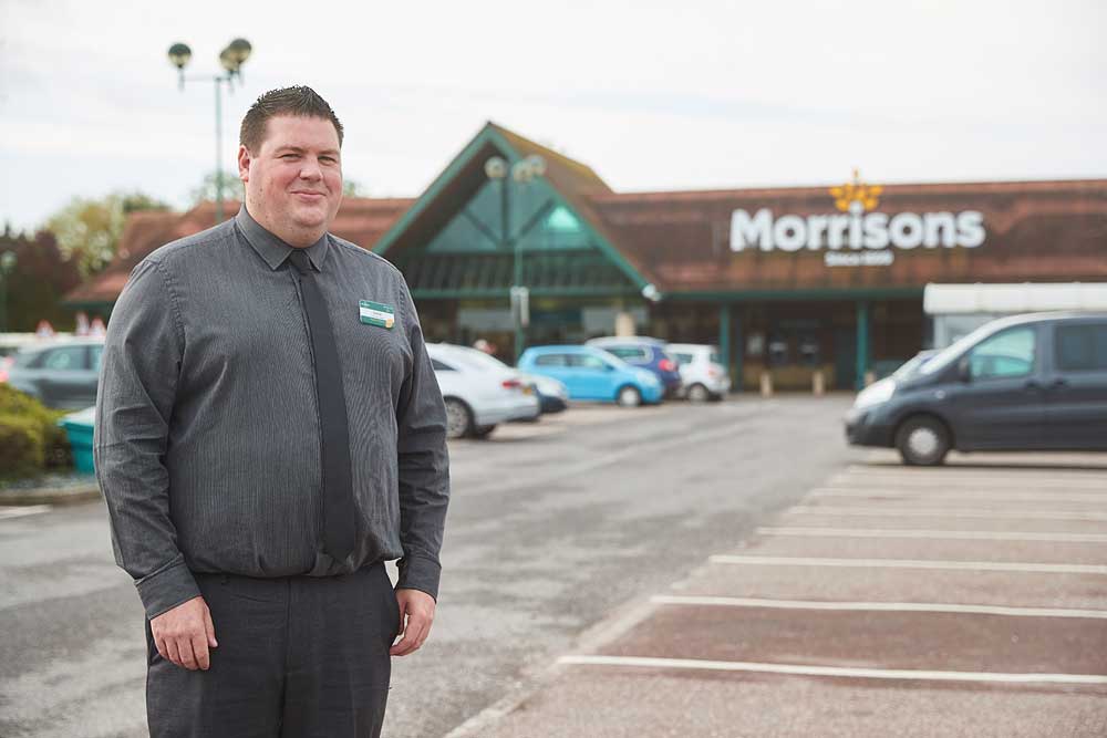 Corporate portrait of Morrisons supermarket manager outside the Bridgwater store