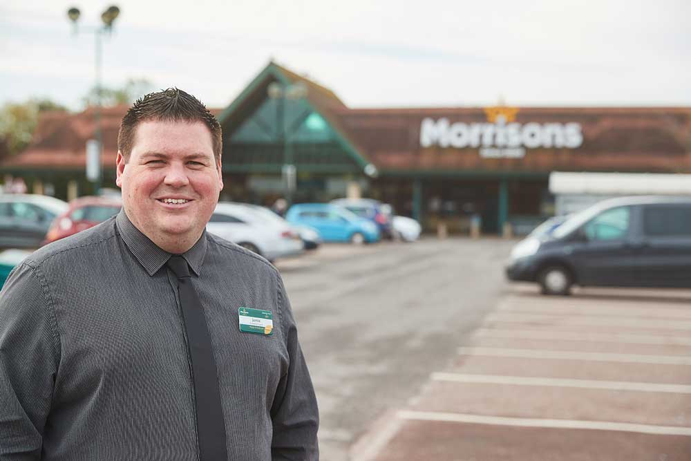 Corporate portrait of Morrisons supermarket manager outside the Bridgwater store