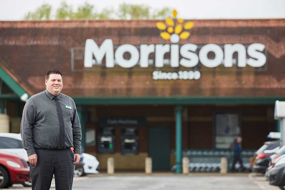 Corporate portrait of Morrisons supermarket manager outside the Bridgwater store