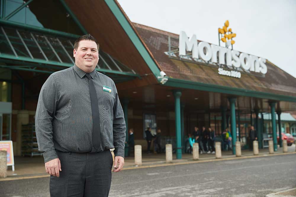 Corporate portrait of Morrisons supermarket manager outside the Bridgwater store