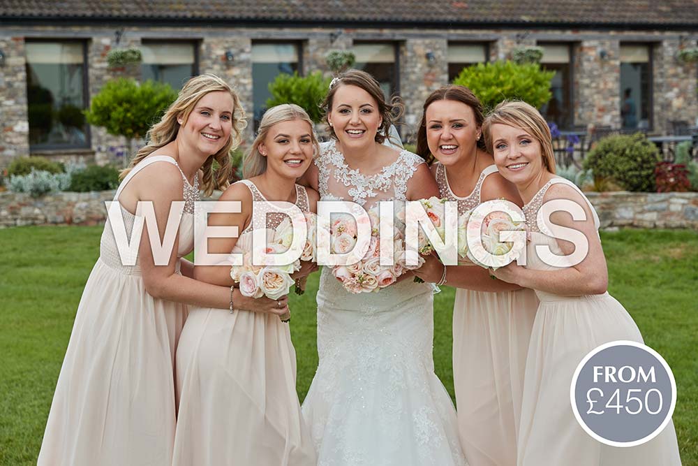 Wedding photographer in Somerset Bride and bridesmaids stood together holding their bouquets